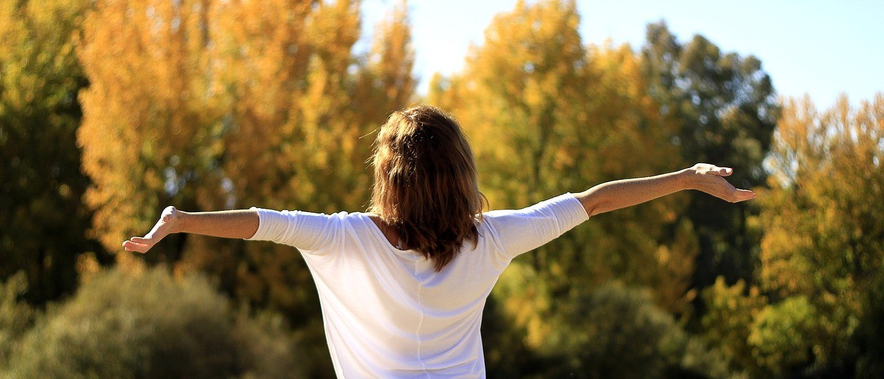 Woman with her arms open